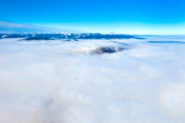Photo of Flying drone over low clouds