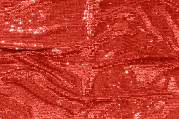 Photo of Large shiny glossy red - burgundy sequins background.