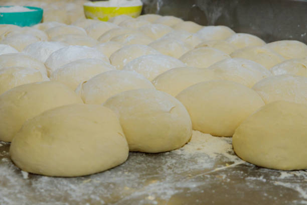 istock Mini bread dough on stainless steel table top 1079659214