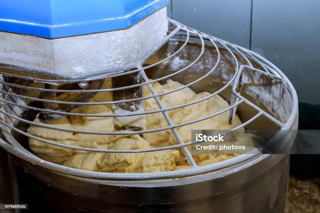 Baker Preparing The Dough For Bread In A Dough Mixer Stock Photo - Download  Image Now - iStock