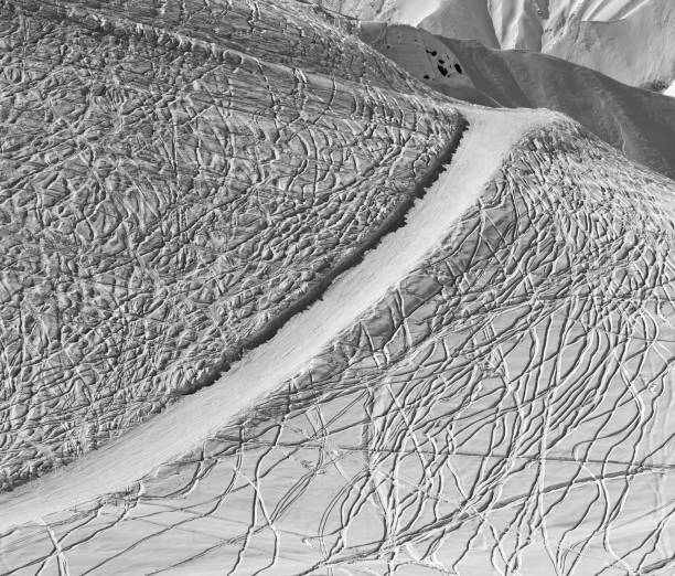 istock Off-piste and groomed slope with trace from ski and snowboards 1079663576