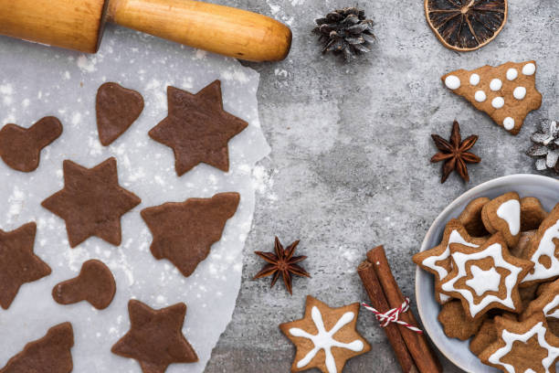 istock Ingredients for cooking Christmas gingerbread cookies with decorations on stone background, top view 1079665088