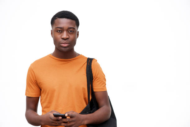 istock serious looking young black man with bag and mobile phone against isolated white background 1079671268