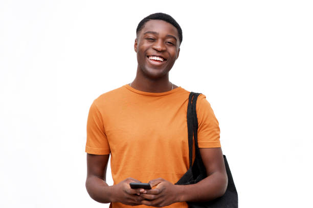 istock young black man laughing with cellphone against isolated white background 1079671298
