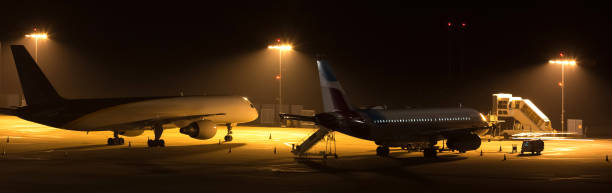 istock airplanes at an airport at night 1079672786