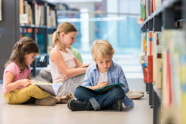 istock Children Sitting On Floor And Reading 1079676316