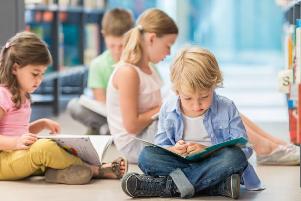 istock Children Sitting On Floor And Reading 1079676382