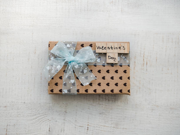 istock Box with a gift, tied with a ribbon, note with sweet words 1079685208