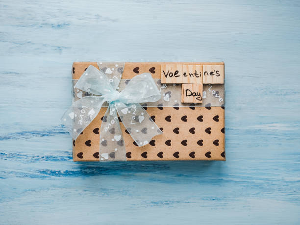 istock Box with a gift, tied with a ribbon, note with sweet words 1079687582