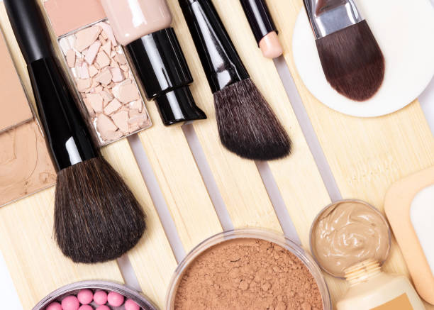 Concealer, primer, foundation, powder, blush with make-up brushes