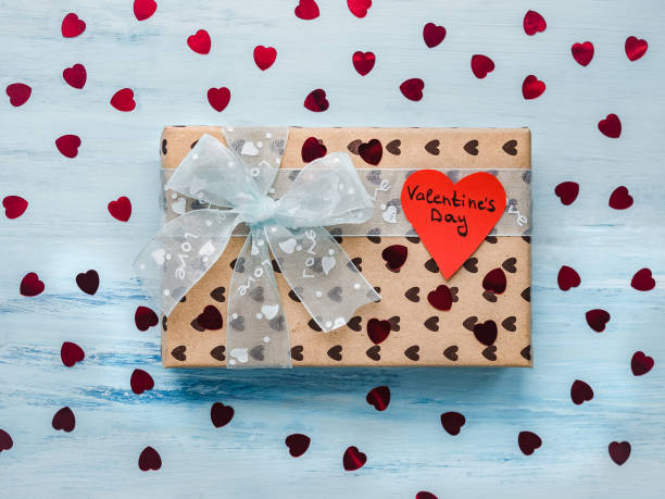 istock Box with a gift, tied with a ribbon, note with sweet words 1079687844