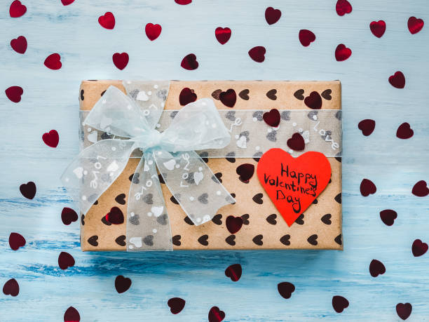 istock Box with a gift, tied with a ribbon, note with sweet words 1079687958