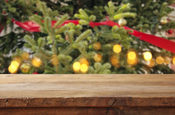 istock Empty table in front of christmas tree with decorations background. For product display montage. 1079688362