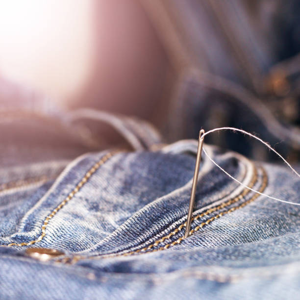 istock The needle and thread on the jeans 1079699178