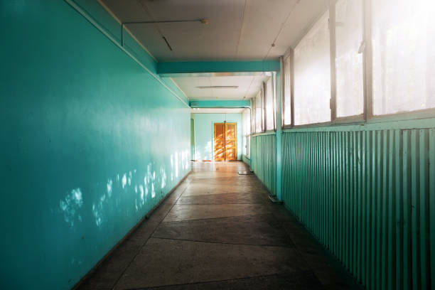 istock Green corridor and door at the end. 1079701116