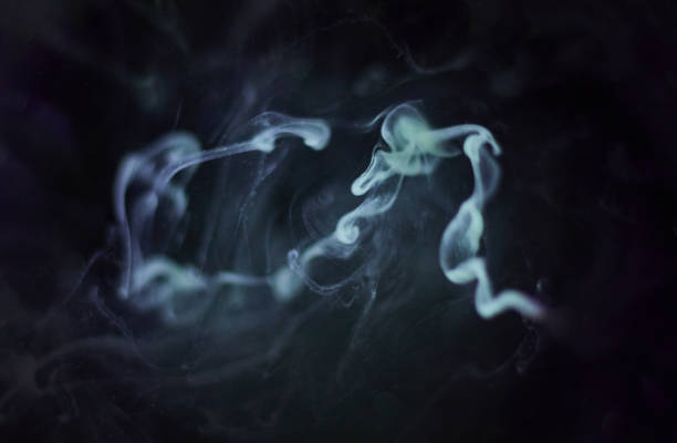 istock Paint colour swirls in dark water 1079703086