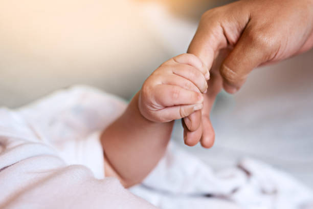 istock When a baby grips your finger, priceless 1079708390