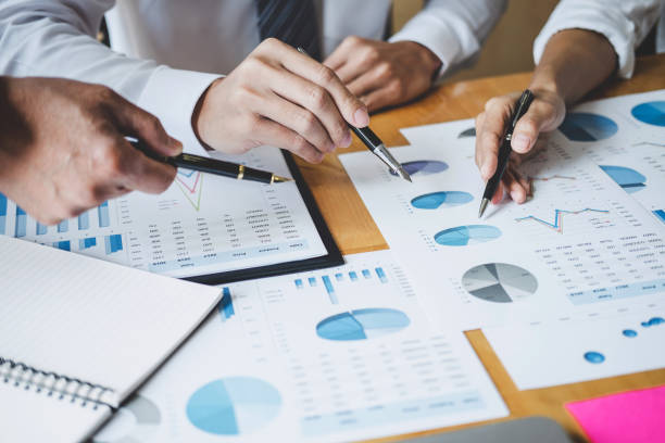 istock Co working conference, Business team meeting present discussing working analysis with financial data and marketing growth report graph in team, Finance, accounting, investment 1079712026