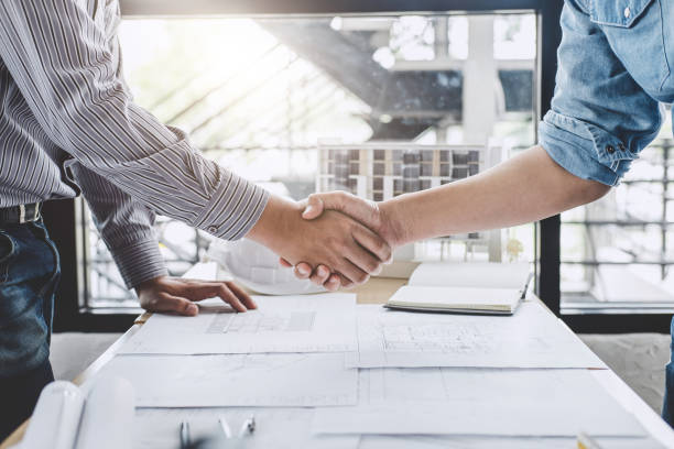 istock Meeting and greeting, Two engineer or architect meeting for project, handshake after consultation and conference new project plan, contract for both companies, success, partnership 1079714662