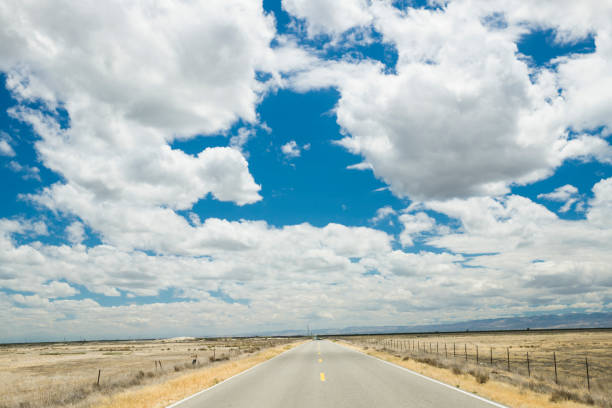 istock Straight road through typical California landscape 1079716942