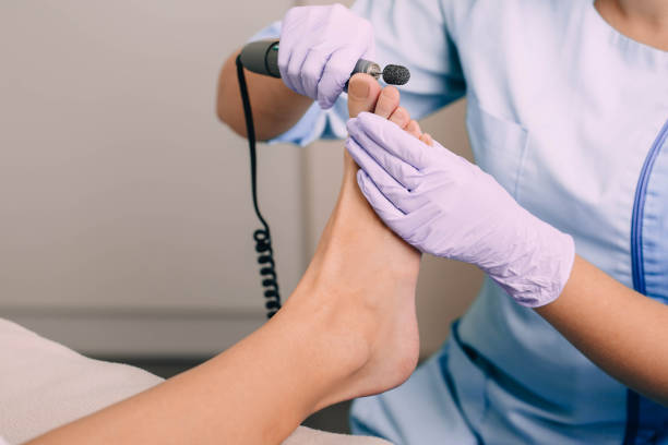 istock Chiropodist treating a patient's foot, pedicure treatment 1079722292