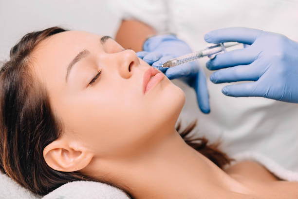 istock woman having lip injection for lip augmentation 1079722310
