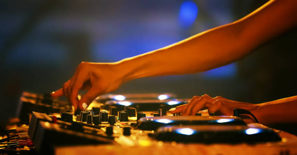 istock Dj Mixing Sound At Nightclub 1079726010