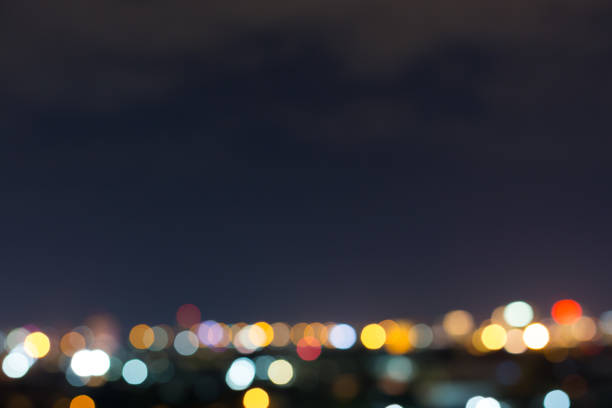 istock city night with dark sky, abstract blur bokeh light background 1079728594