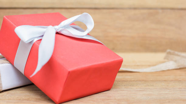 istock Close-Up Of Red Wrapped Gift On Table 1079729466