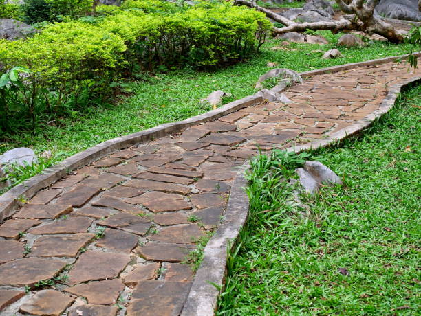 istock Stone  walk on grass in garden 1079732348