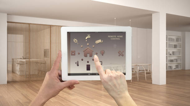 istock Smart remote home control system on a digital tablet. Device with app icons. Minimalist white and wooden living room with dining table, architecture interior design 1079734238