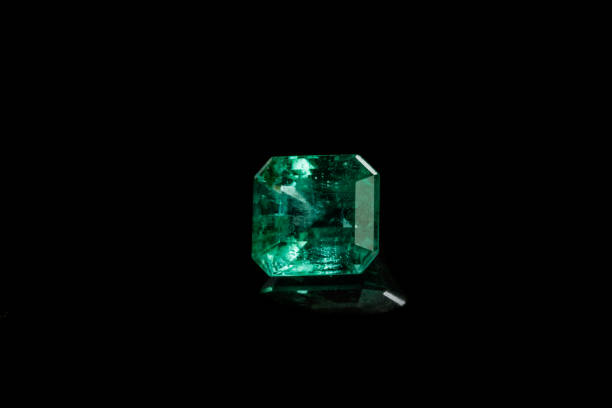 istock Macro mineral Emerald gemstone faceted on black background 1079742408