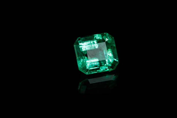 istock Macro mineral Emerald gemstone faceted on black background 1079742644