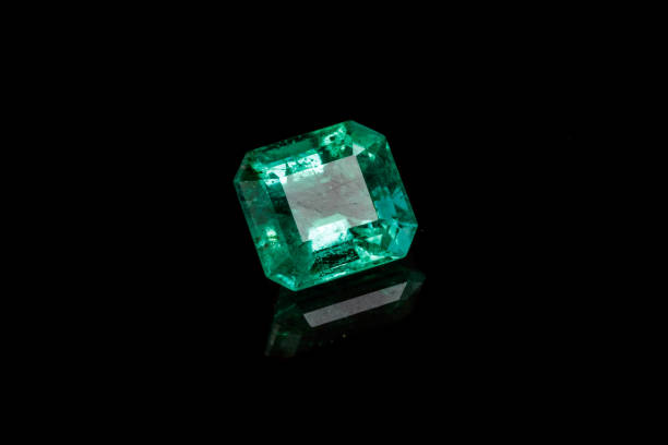 istock Macro mineral Emerald gemstone faceted on black background 1079742726