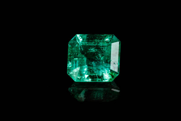 istock Macro mineral Emerald gemstone faceted on black background 1079742908