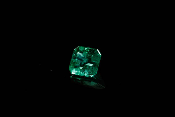 istock Macro mineral Emerald gemstone faceted on black background 1079743170
