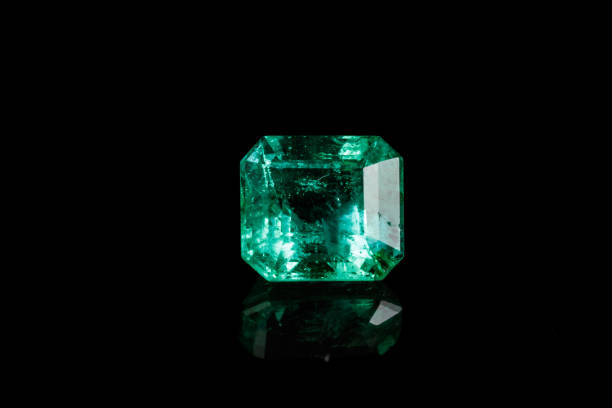 istock Macro mineral Emerald gemstone faceted on black background 1079743266