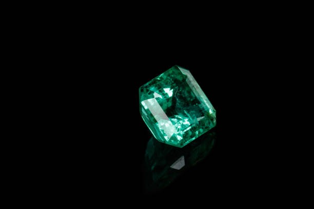 istock Macro mineral Emerald gemstone faceted on black background 1079743342