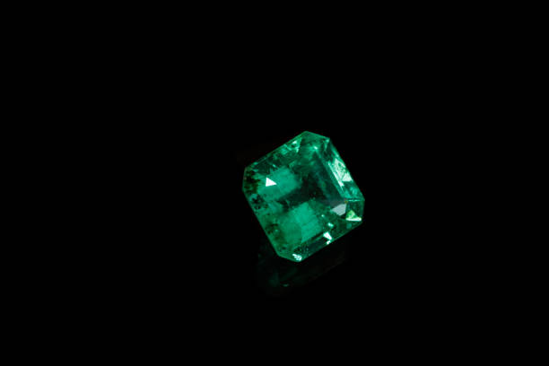istock Macro mineral Emerald gemstone faceted on black background 1079743384