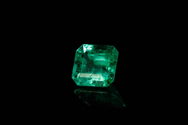 istock Macro mineral Emerald gemstone faceted on black background 1079743866