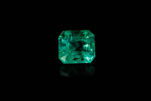 istock Macro mineral Emerald gemstone faceted on black background 1079744004