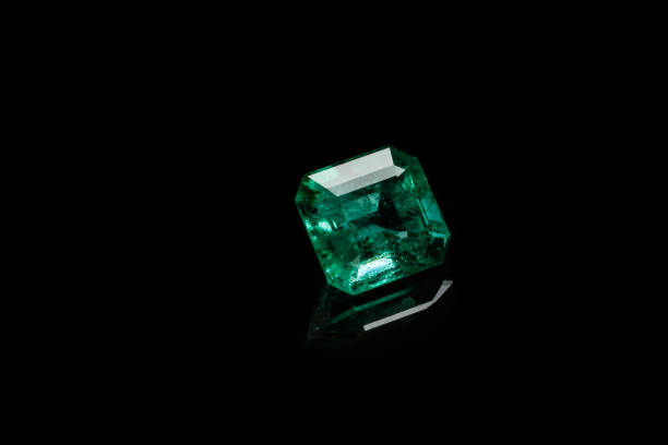 istock Macro mineral Emerald gemstone faceted on black background 1079744088