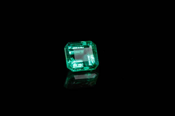 istock Macro mineral Emerald gemstone faceted on black background 1079744480