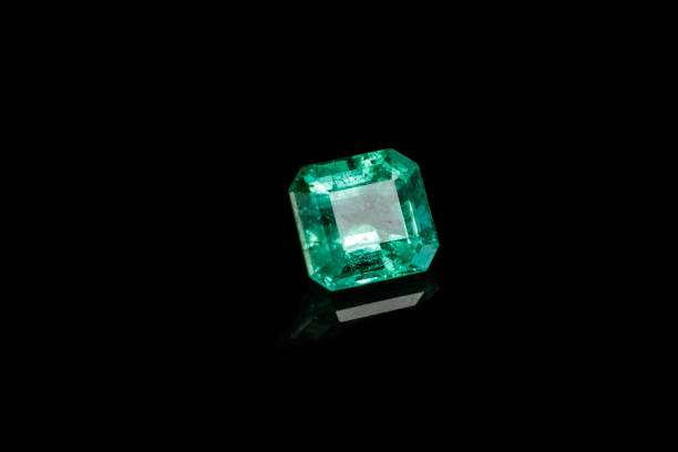istock Macro mineral Emerald gemstone faceted on black background 1079744514