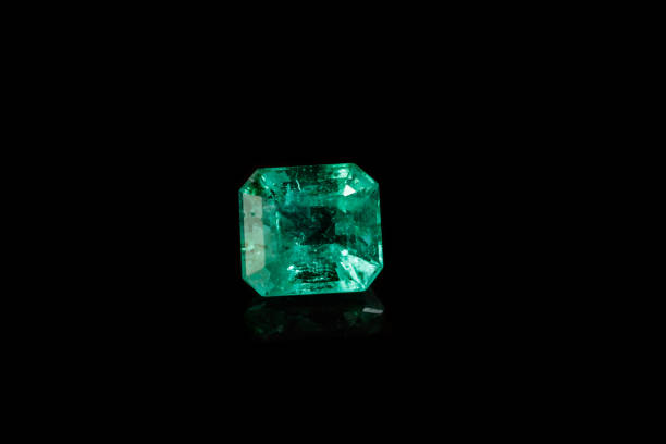 istock Macro mineral Emerald gemstone faceted on black background 1079744622