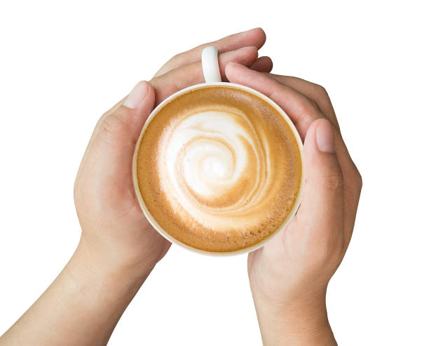 istock Hands holding hot cappuccino coffee isolated on white background, clipping path included 1079746194