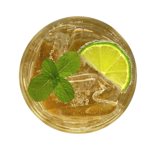 istock Honey lime drink cocktail with mint top view isolated on white background 1079746218