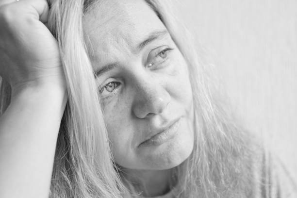 istock A young woman looks with sadness 1079748062