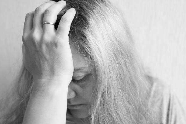 istock A young woman looks with sadness 1079748072