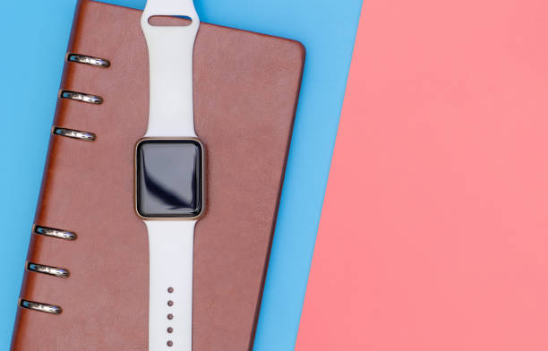 istock Smart watch on notebook for organize concept with blue pink 1079750150